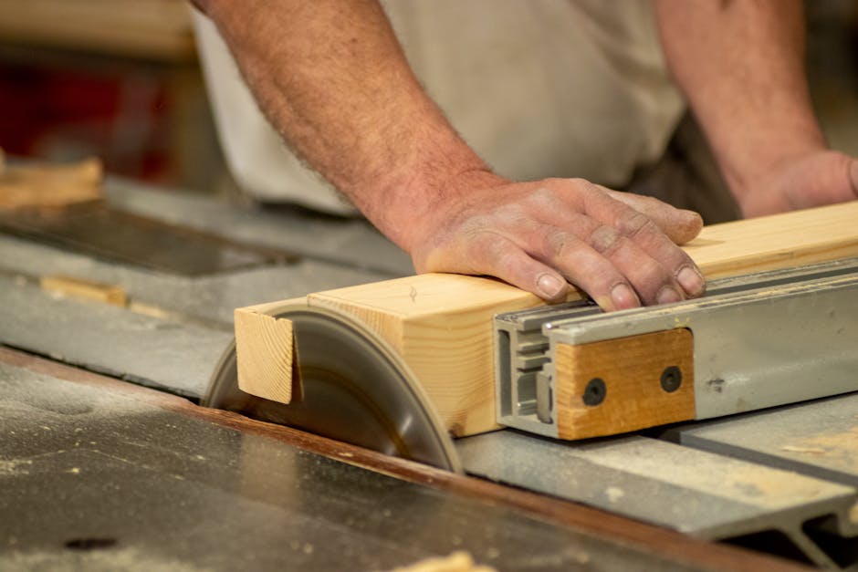 Carpenter making cabinets in workshop